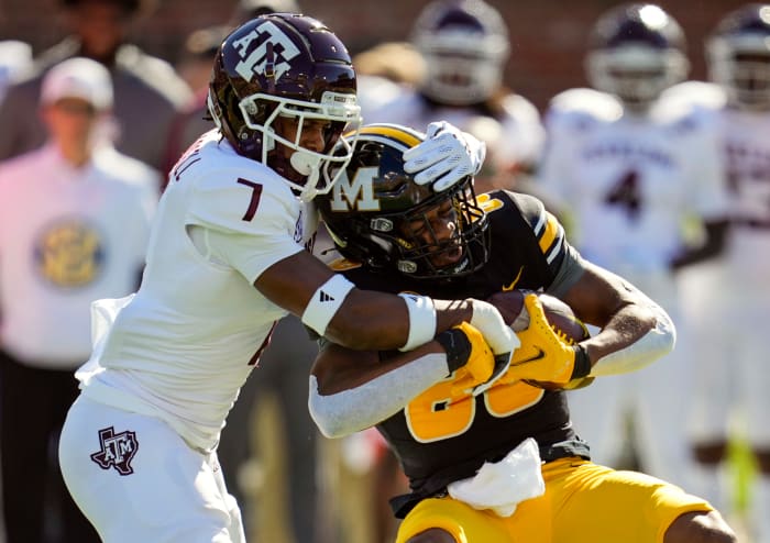 Oct 16, 2021; Columbia, Missouri, USA; Missouri Tigers wide receiver Tauskie Dove (86) is tackled by Texas A&M Aggies defensive back Tyreek Chappell (7) during the first half at Faurot Field at Memorial Stadium.